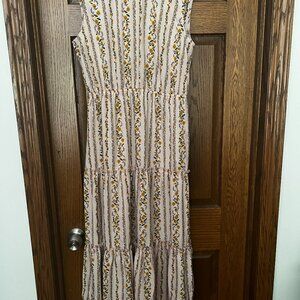 Sleevess dress. Light pink with striped floral pattern.